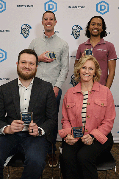 Dakota State’s faculty award winners for the 2024-2025 academic year include: Dr. Mike Ham (back left), Peter Britton; Dr. Andrew Behrens (front left), Dr. Betsy Schamber. 