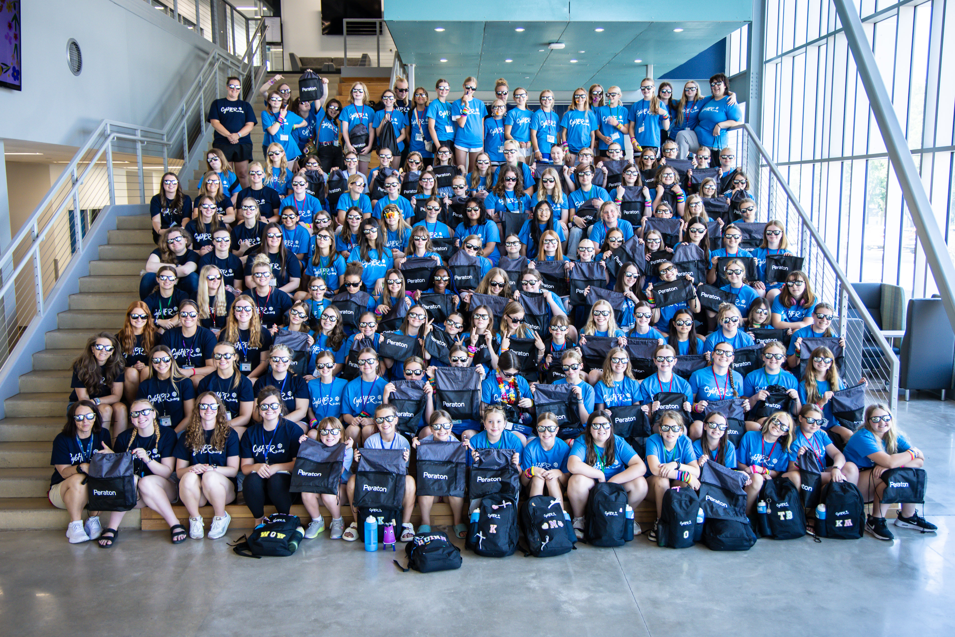 Group photo of 2025 campers in blue shirts at DSU