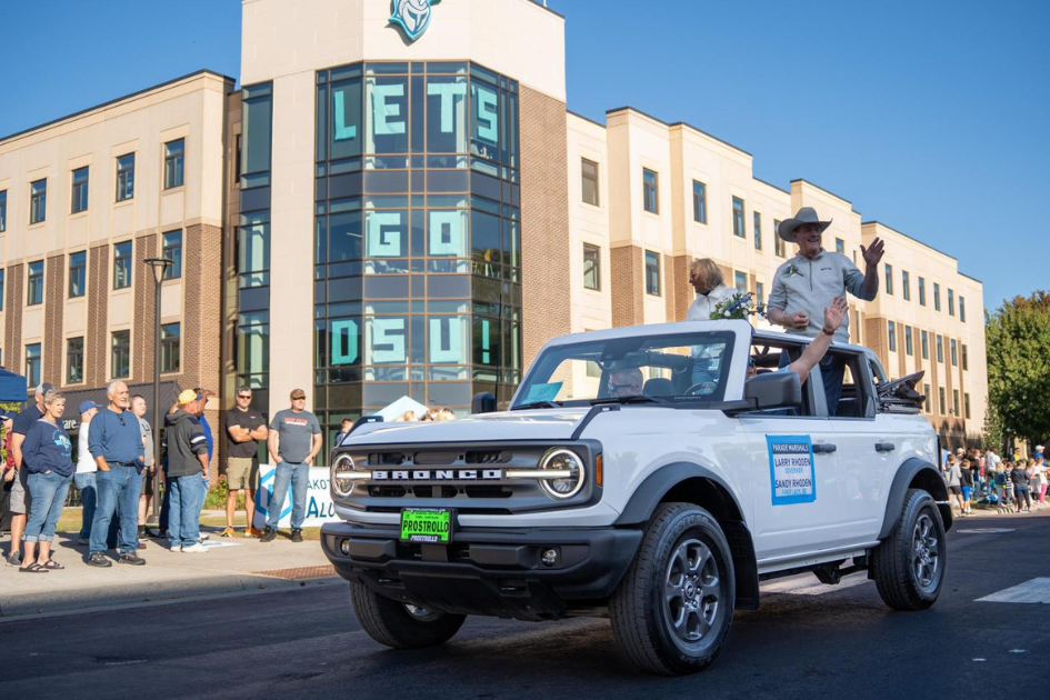 Last year's parade marshal lead the homecoming parade.
