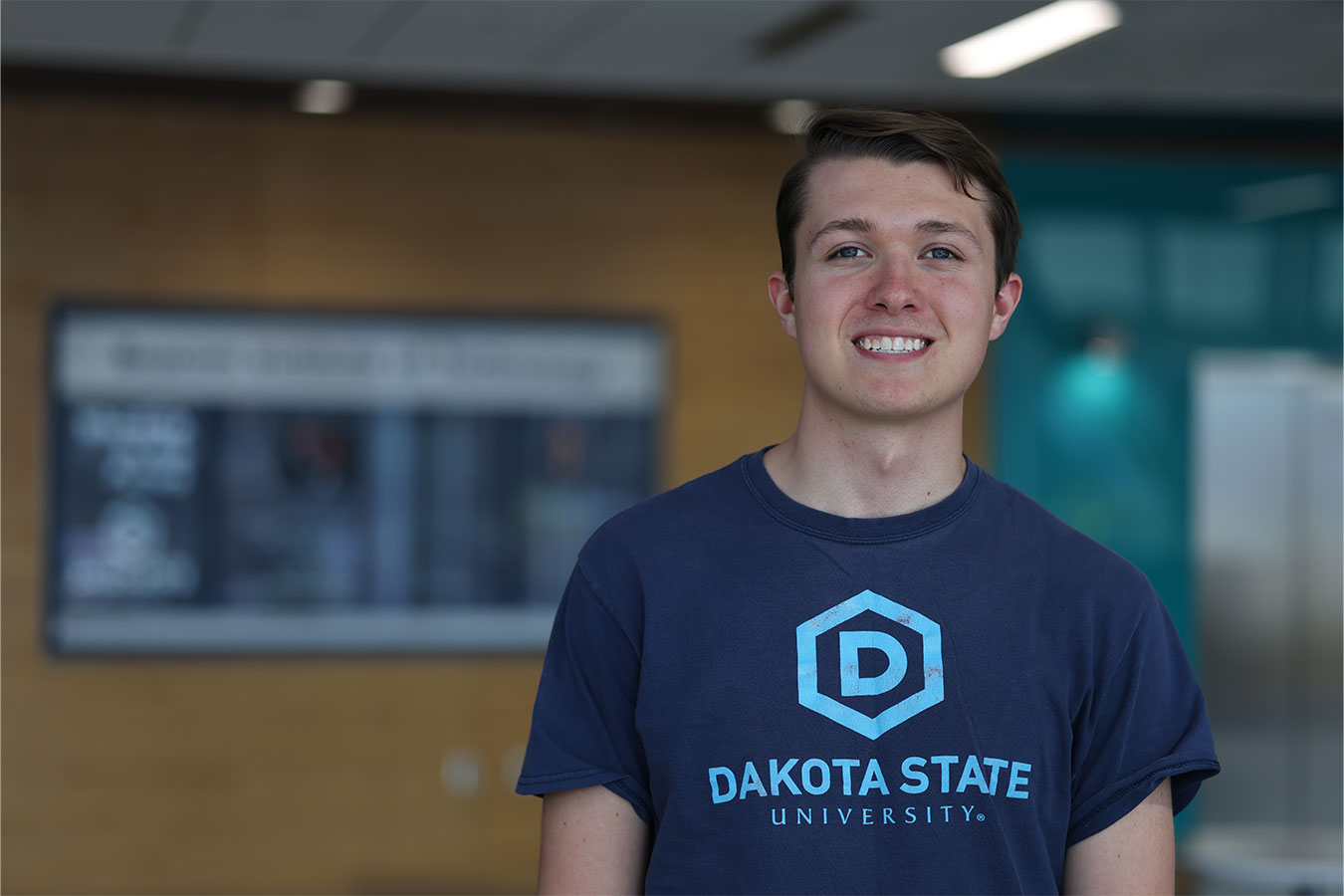 Ashton Ruesch in a DSU shirt on campus.