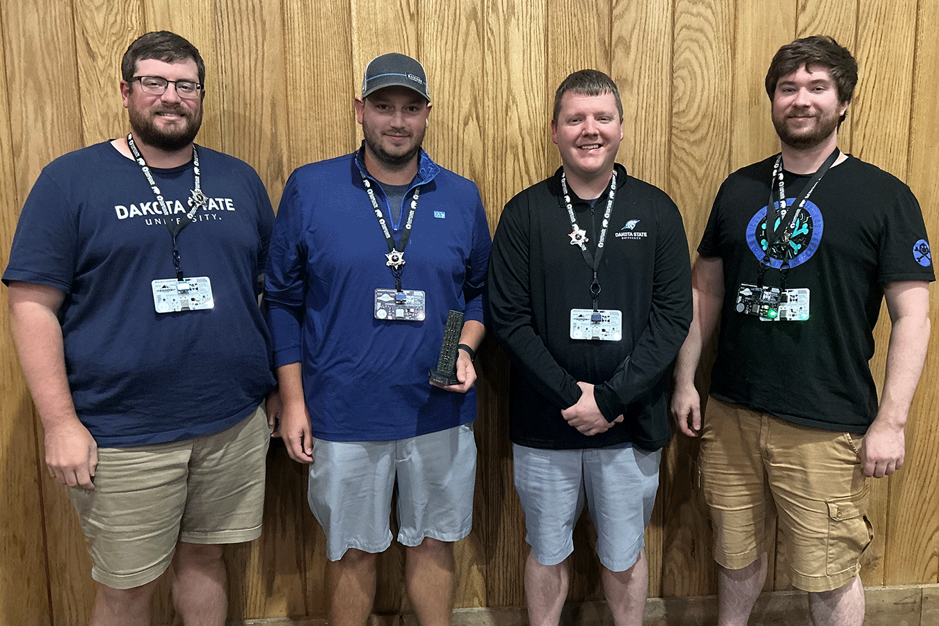 DSU faculty who won the capture the flag competition at the Wild West Hackin’ Fest are Cody Welu, Tyler Flaagan, Shawn Zwach, and Andrew Kramer.