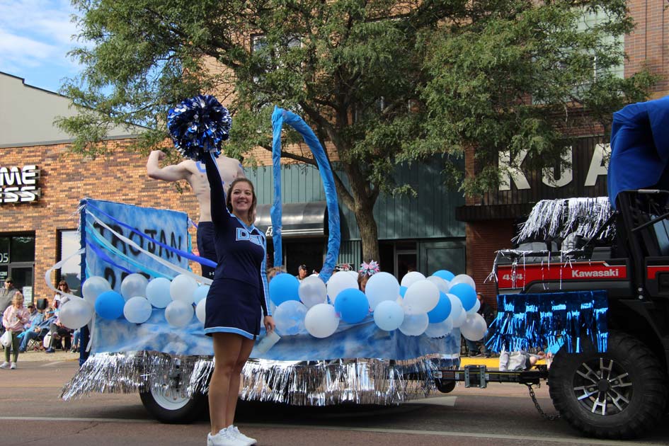 DSU homecoming day parade float with DSU cheerleader