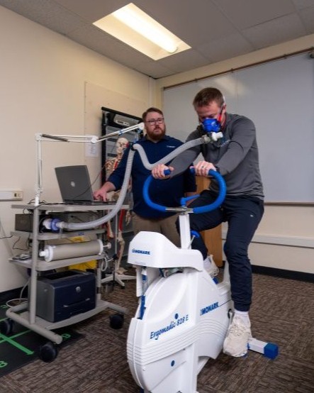 exercise science student riding bike