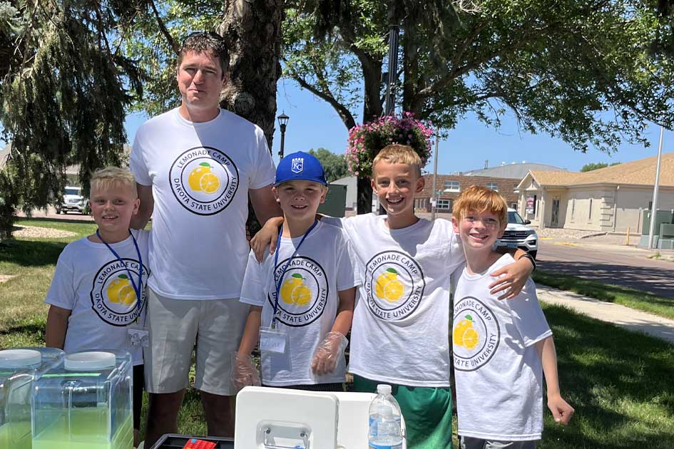Chad Knutson, co-owner of SBS Cybersecurity, mentors a team of youth at Lemonade Camp.