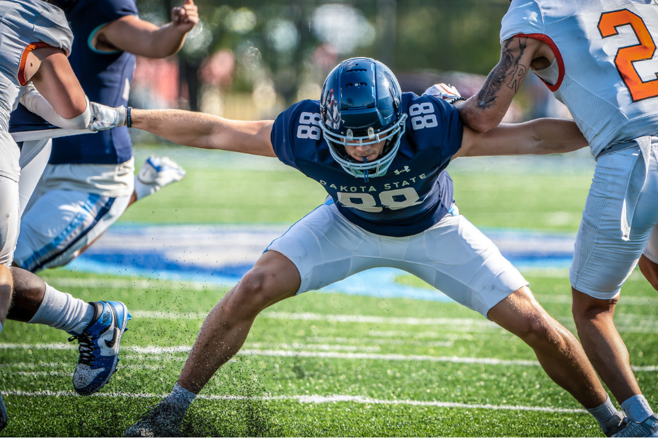 trojan football player playing in game