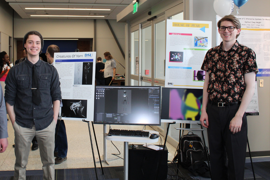 Students displaying research projects.