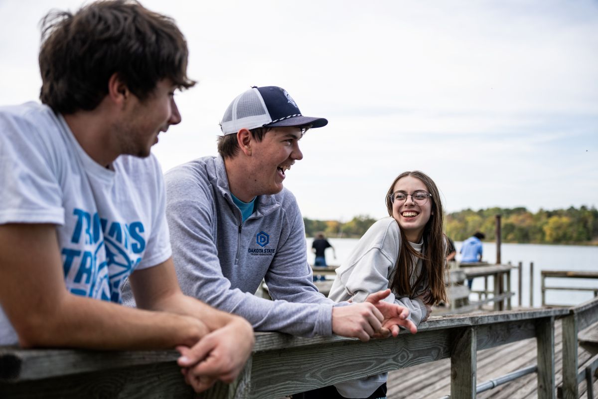 students on dock at lake herman