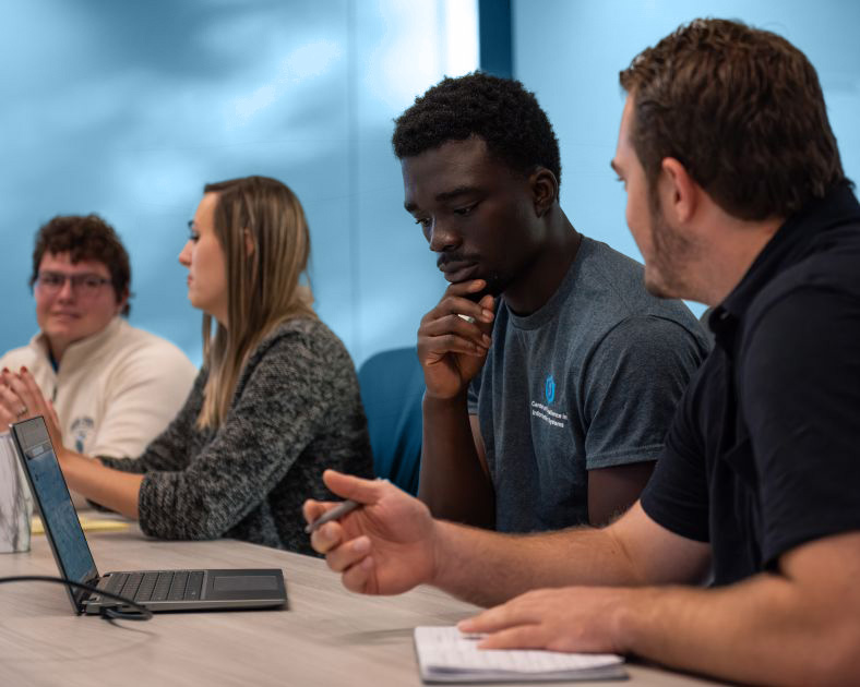 dsu students conversing in class