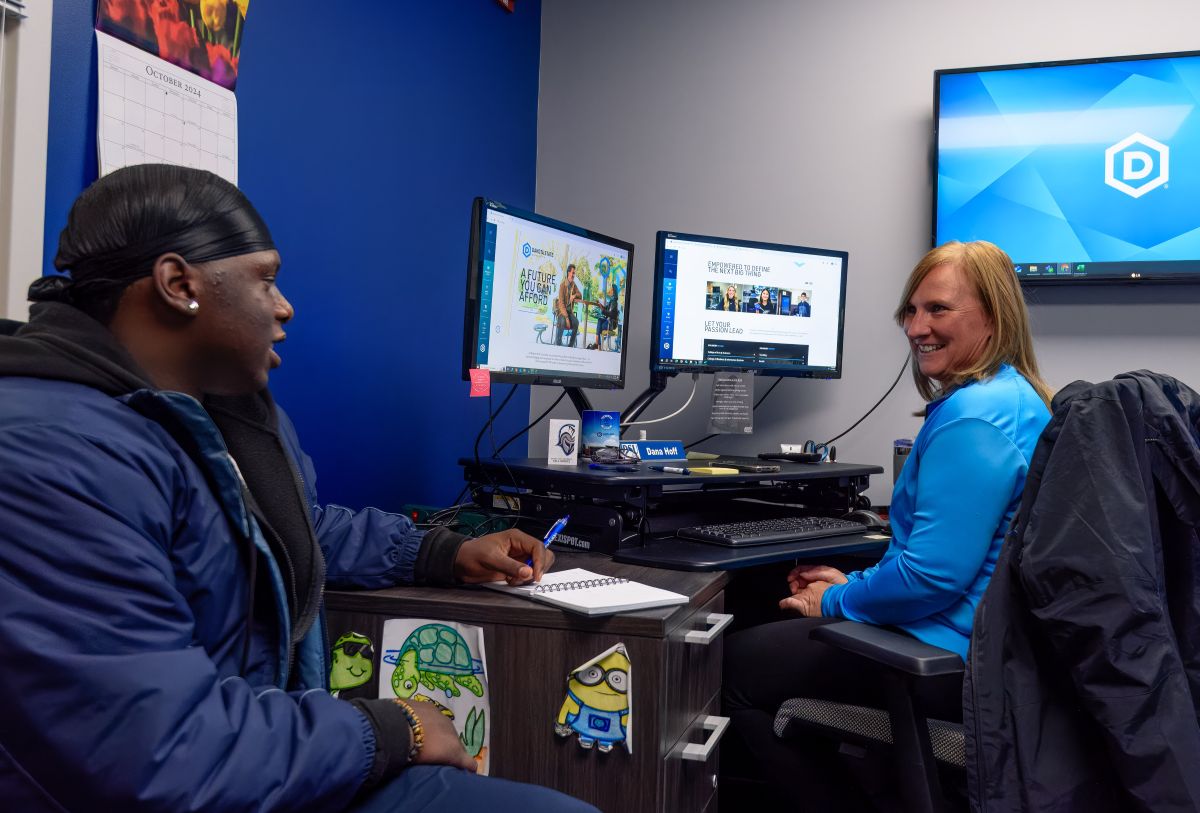 student talking to advisor in office