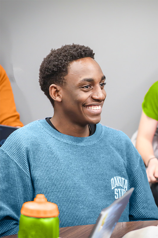 DSU student smiling in class
