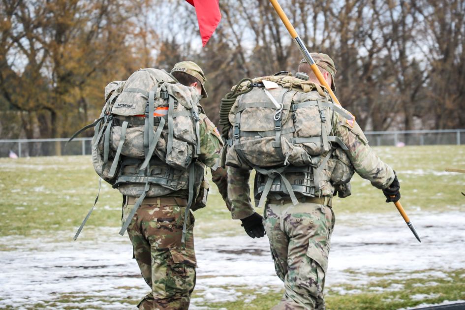two dsu military students walking on track with uniforms on