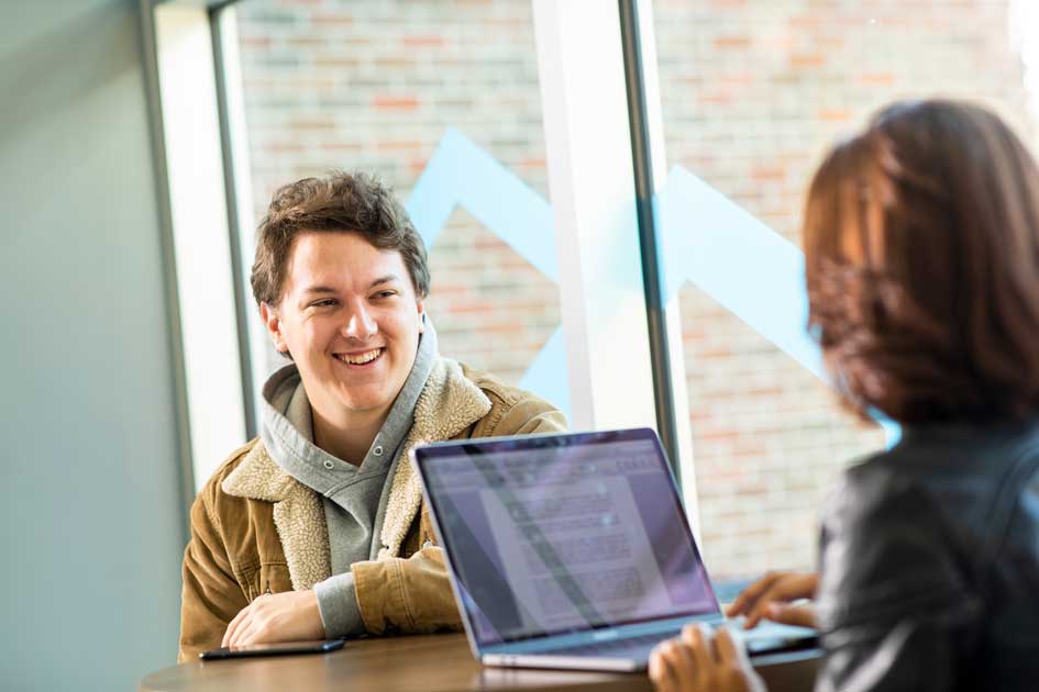 DSU international students study together in the library.