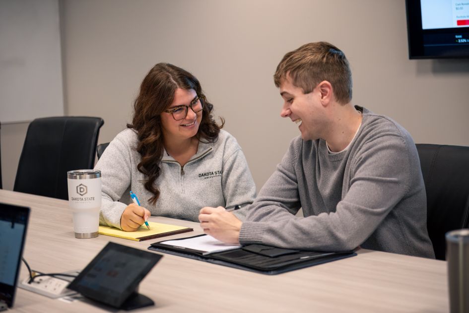 two DSU masters students in class