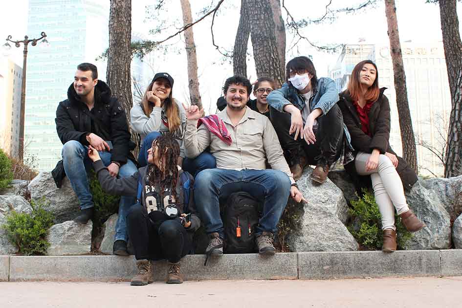 group of students sitting outside