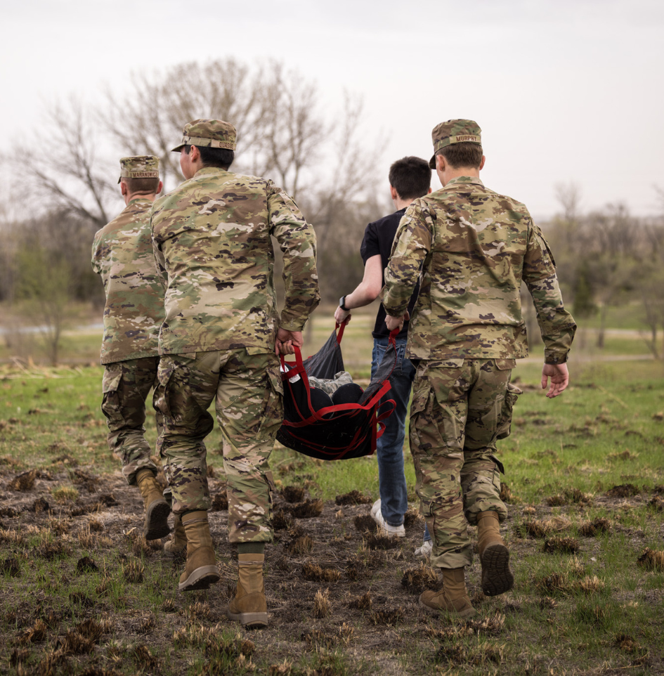 dsu cadets in field with bag of down soldier
