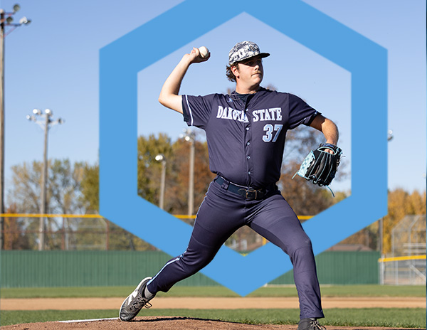 DSU pitcher throwing a baseball. he is wearing a blue trojan uniform. a large superimposed hexagon looms in the background.