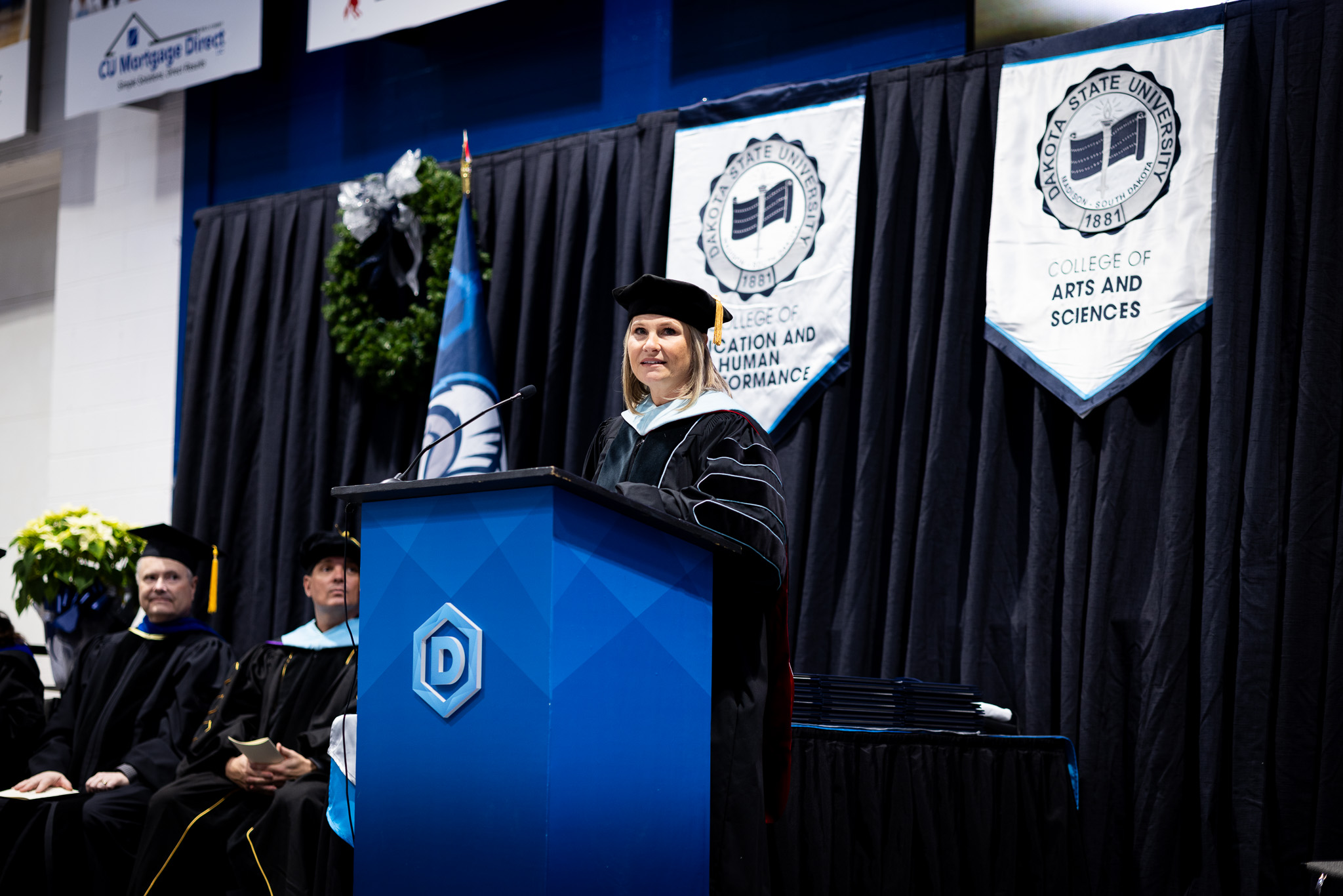 Dakota State University provost Hoey delivering a commencement address.