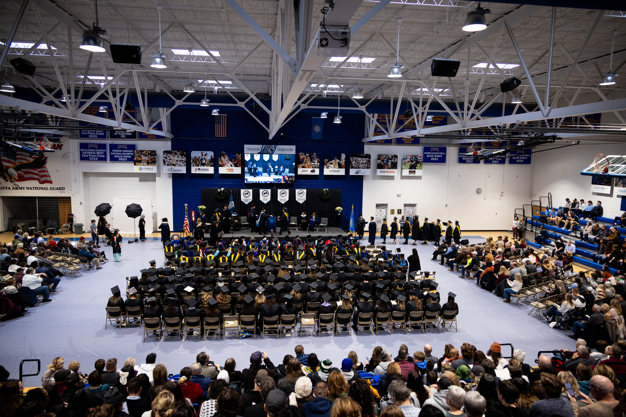 The commencement event in the fieldhouse. 
