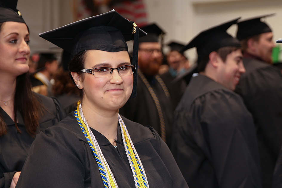 DSU graduate smiling during commencement