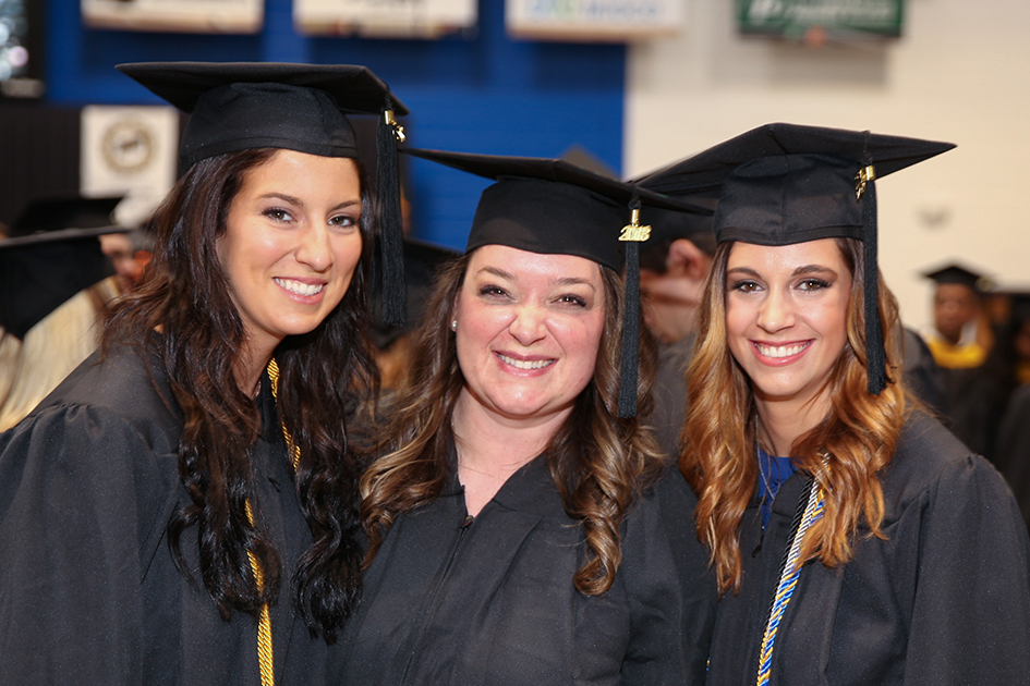 Photo of three DSU graduates