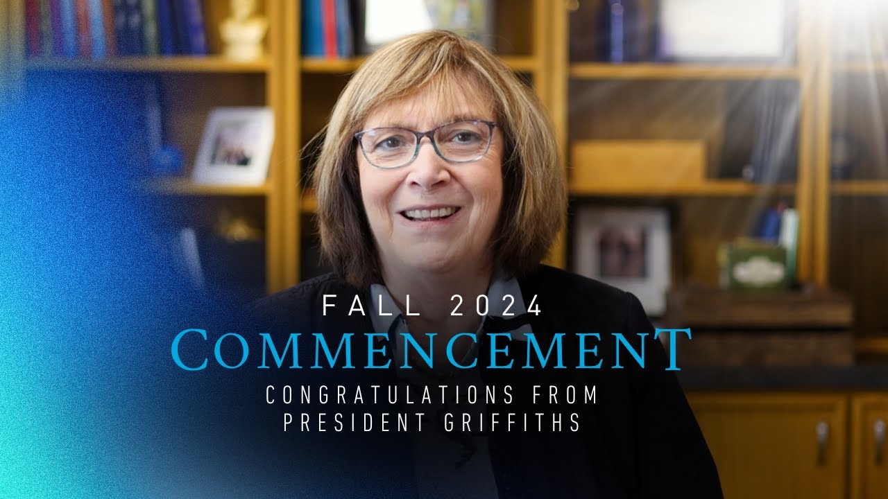 Dakota State University President Griffiths shaking hands with a graduate