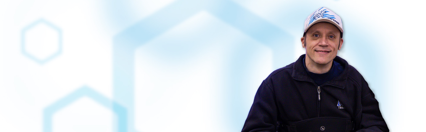 Dr. Chris Olson on right side of image with white background and blue hexagons