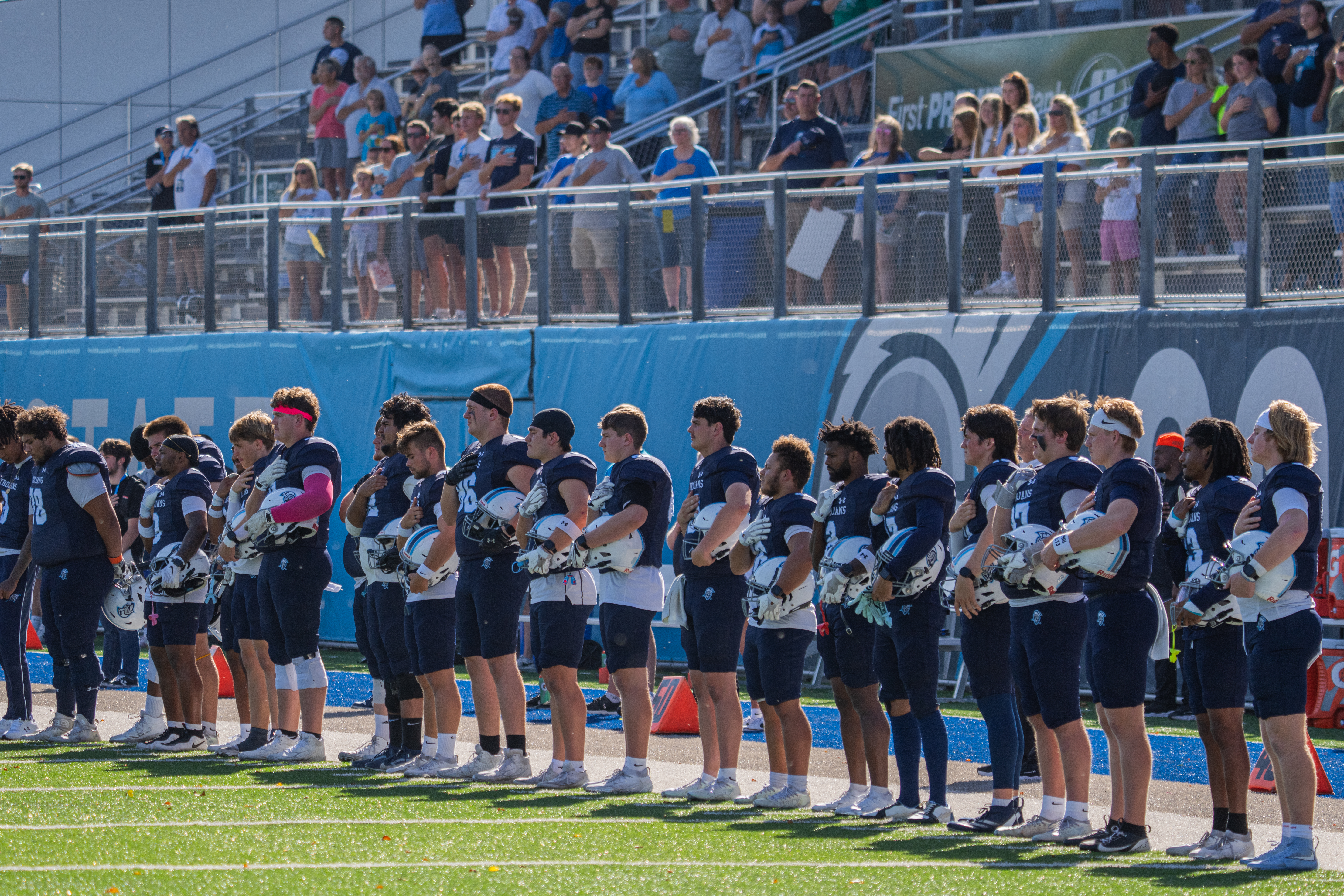 The DSU football team stands for the National Anthem.