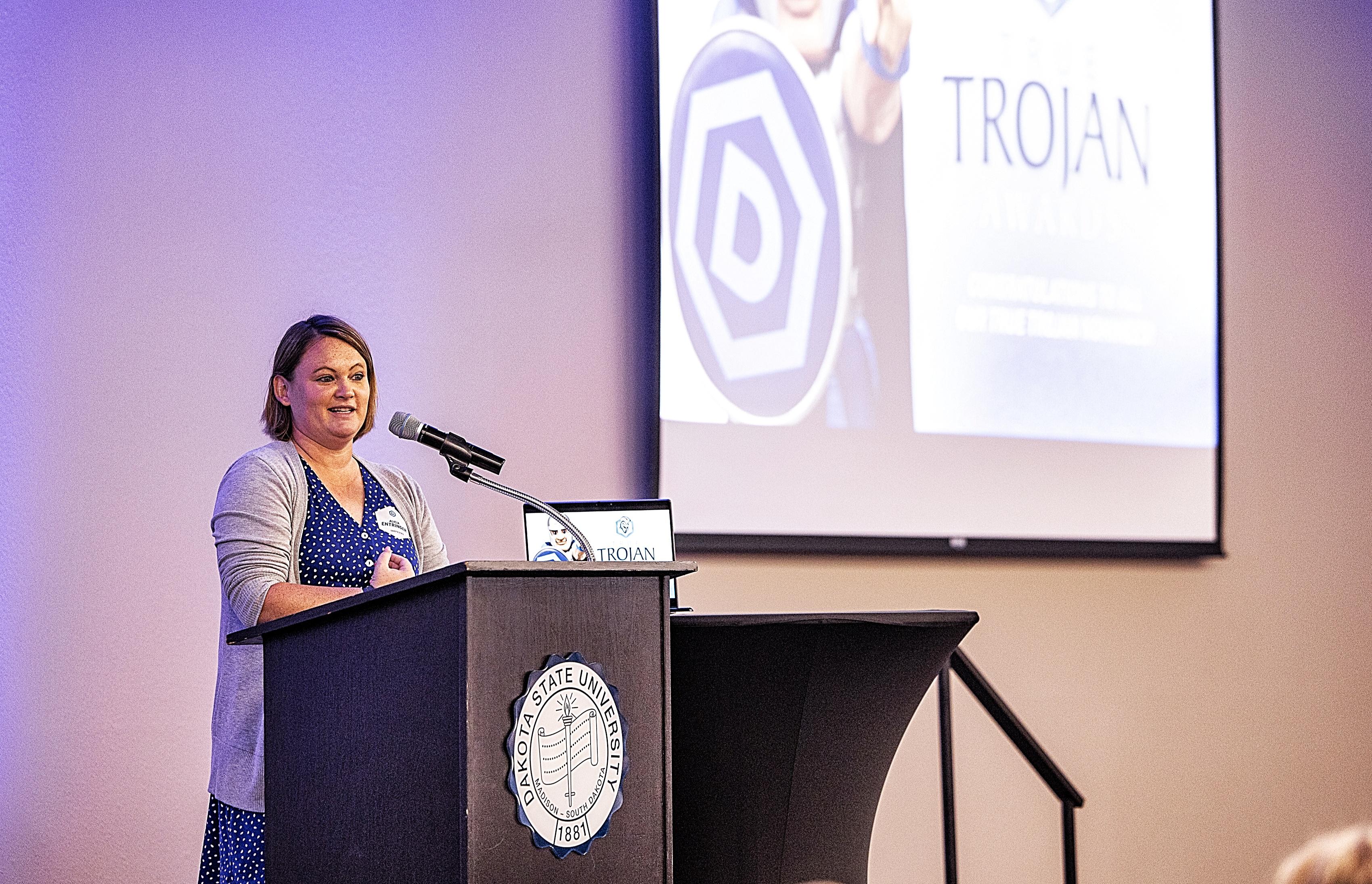 Human Resources Manager Alicia Entringer presents the True Trojan Awards.