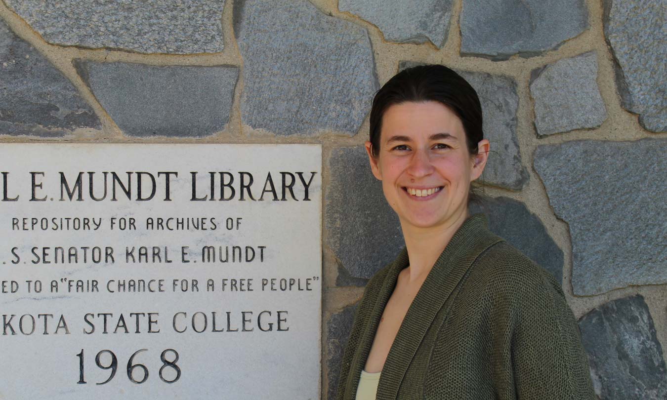 Mary Francis standing in front of the Karl Mundt Library
