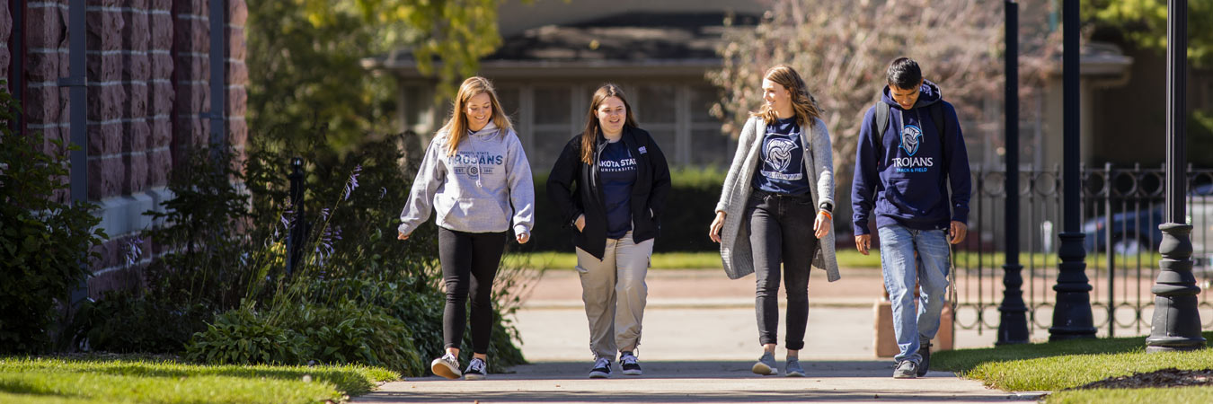 Students walking through campus on move in day