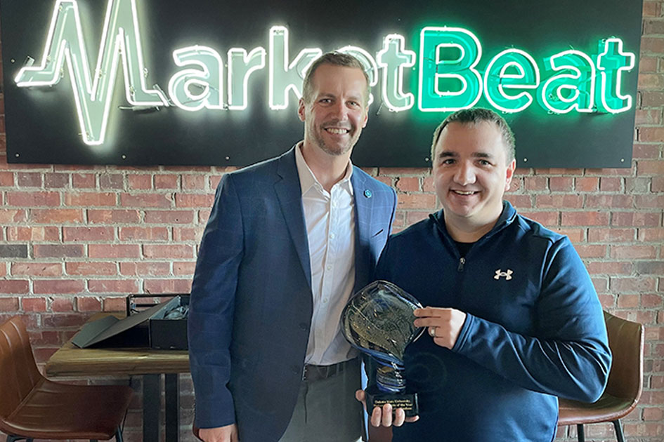 Jon Schemmel, VP for Institutional Advancement & Director of the DSU Foundation and Alumni Association, presents Matt Paulson, DSU alum and Founder of MarketBeat with Philanthropist of the Year award. 