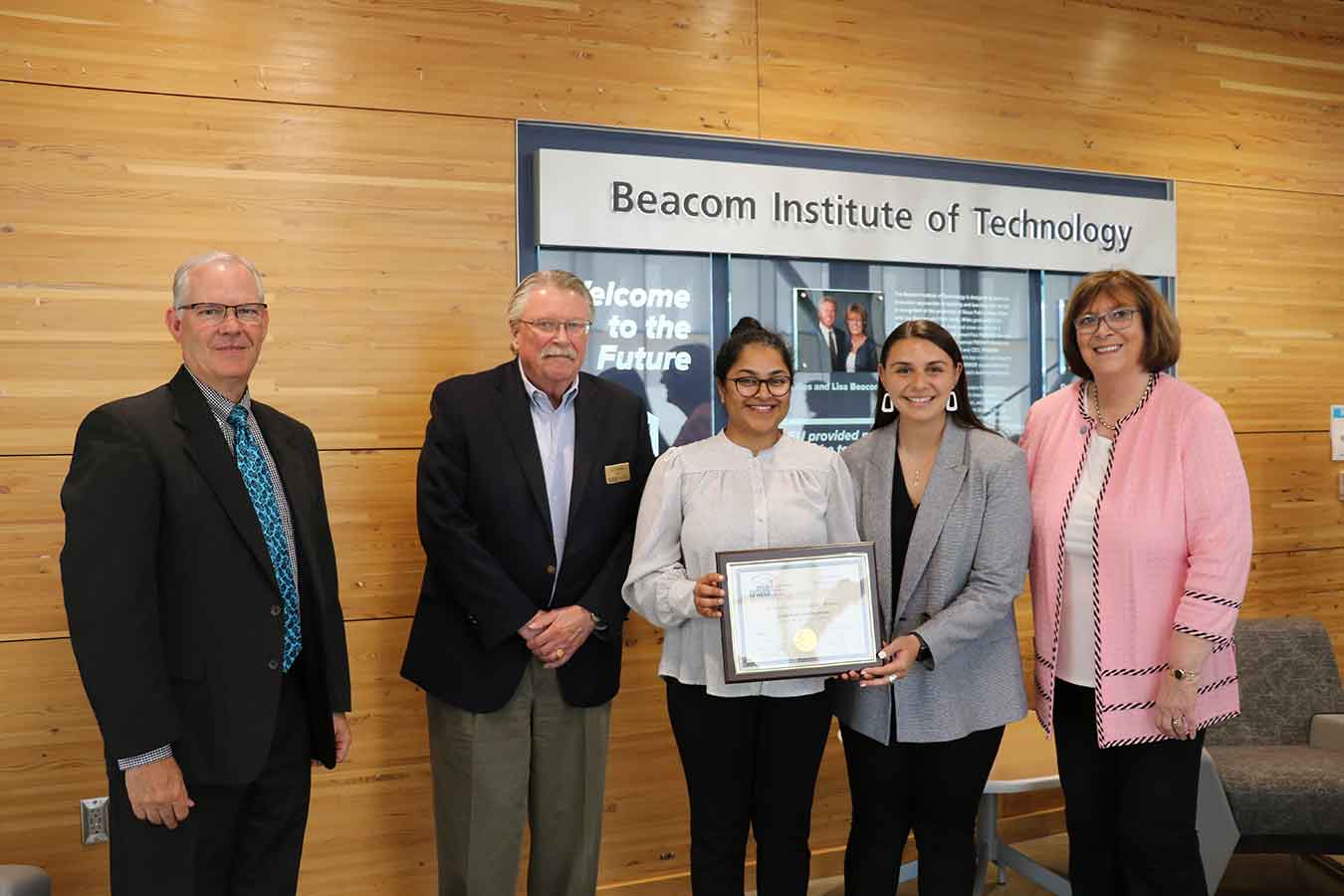 Pictured: BOR Executive Director Brian Maher, BOR President John Bastian, Students Kanthi Narukonda and Janessa Palmieri, and DSU President José-Marie Griffiths