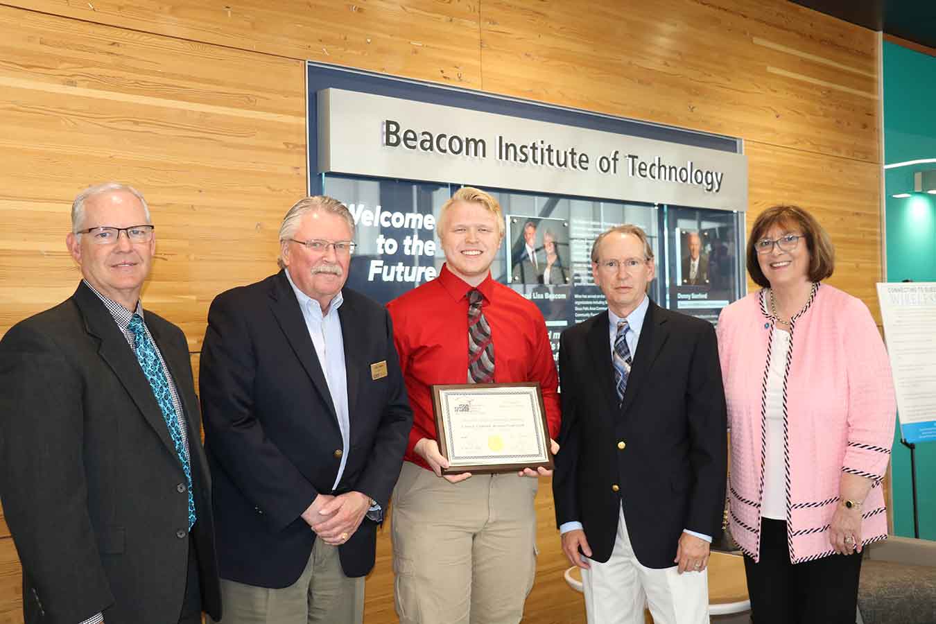 BOR Executive Director Brian Maher, BOR President John Bastian, Student Max Hardyk, Advisor Joe Staudenbauer, and DSU President José-Marie Griffiths