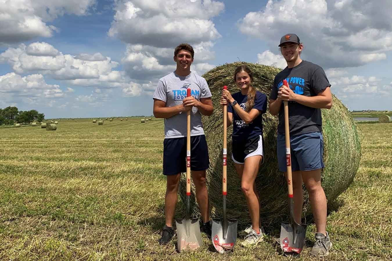 Pictured (l-to-r): Conner Tordsen, Jenni Giles and Travis Rebstock visited various growers in eastern South Dakota to take soil samples for alfalfa research earlier this summer. 