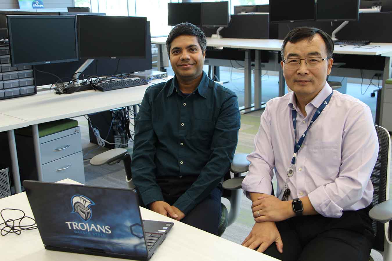Dr. Bhaskar Rimal (left) and Dr. Yong Wang have received an NSA grant to study Internet of Things device identification. Wang is Associate Professor of Computer & Cyber Sciences, and Rimal is Assistant Professor of Computer & Cyber Sciences in The Beacom College of Computer and Cyber Sciences. They are co-directors of the PATRIOT Lab.ssor of Computer & Cyber Sciences