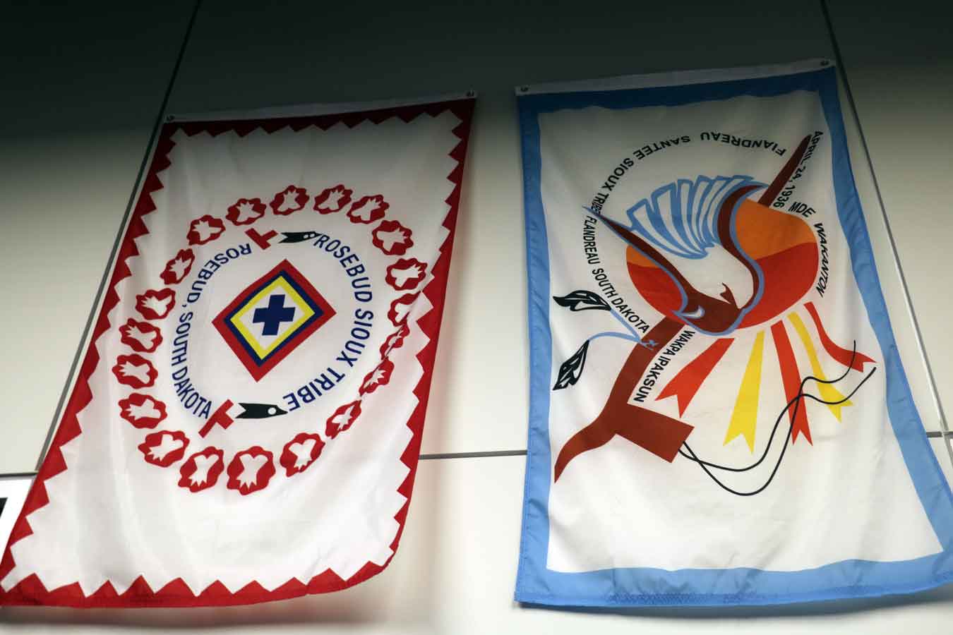 Native American flags displayed at the Trojan Center