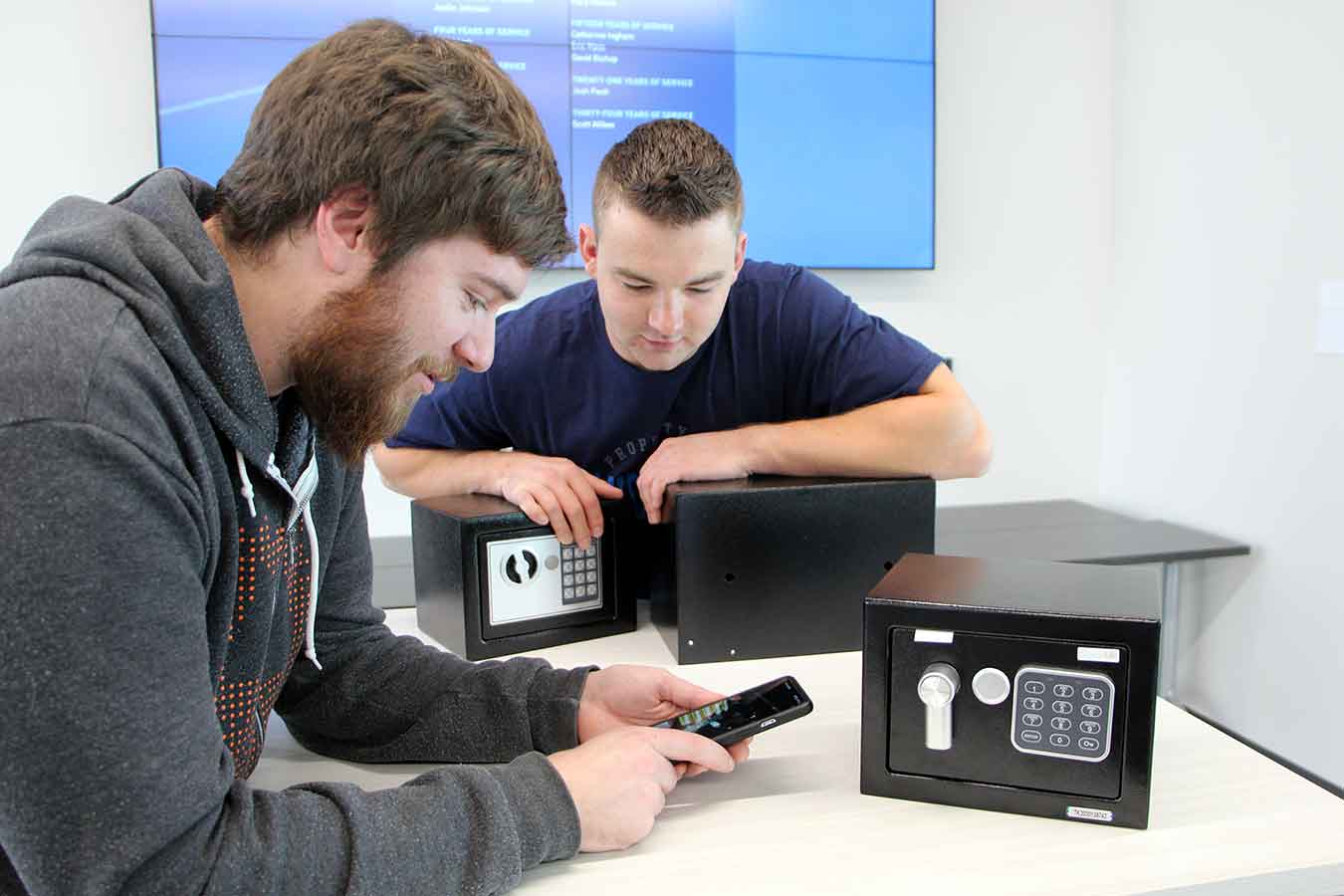 Jakob Kaiser (right) is researching hotel safes, with faculty mentor Andrew Kramer. This is one of eleven undergraduate Student Research Initiative grant projects funded this academic year.