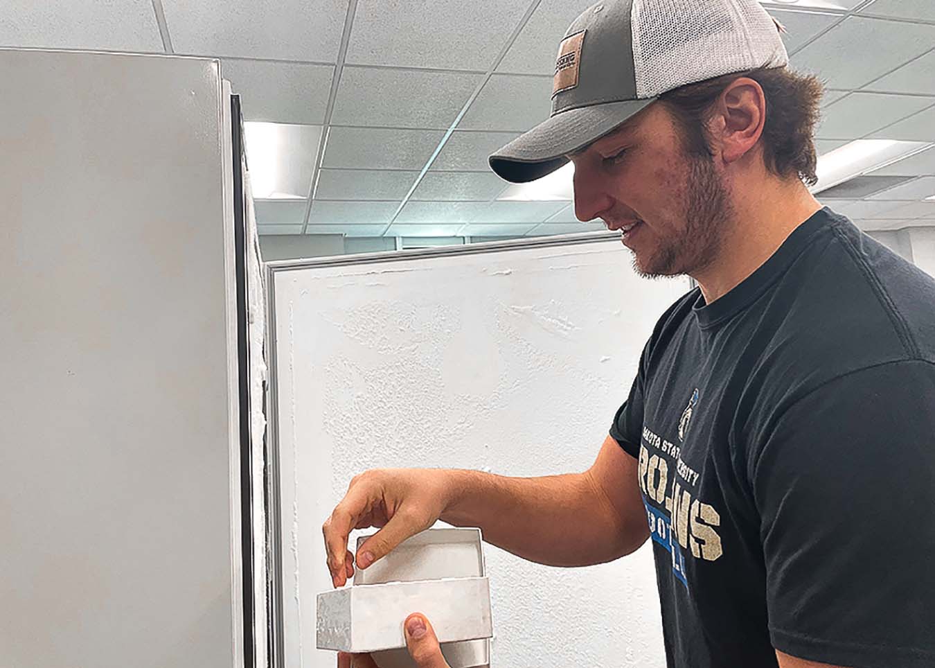 Tordsen removes a sample from the lab freezer.