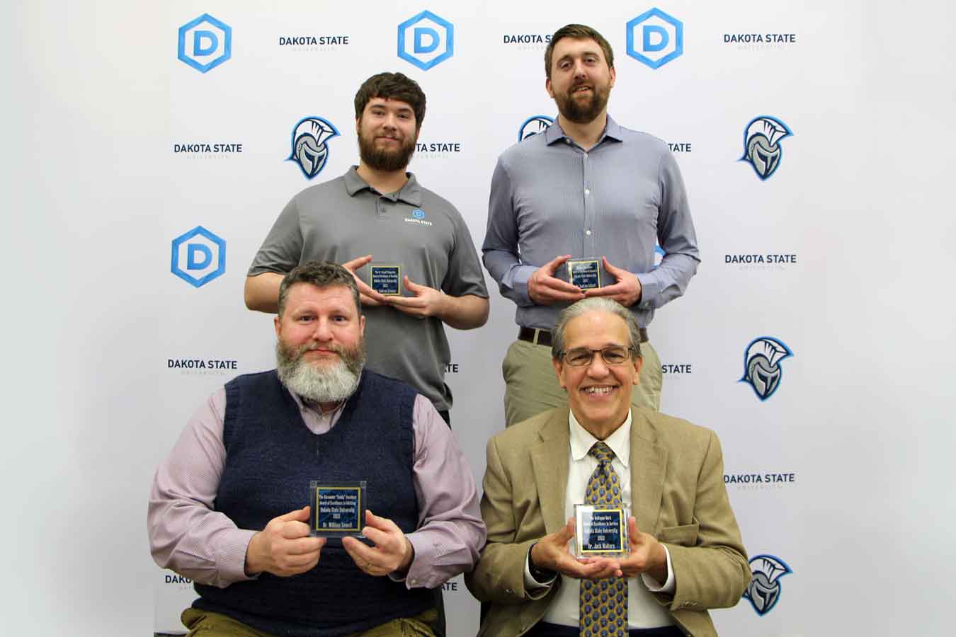 Dakota State’s Faculty award winners for the 2021-2022 academic year include: Andrew Kramer (back left), Dr. Andrew Sathoff; Dr. William Sewell (front left), Dr. Jack Walters. 