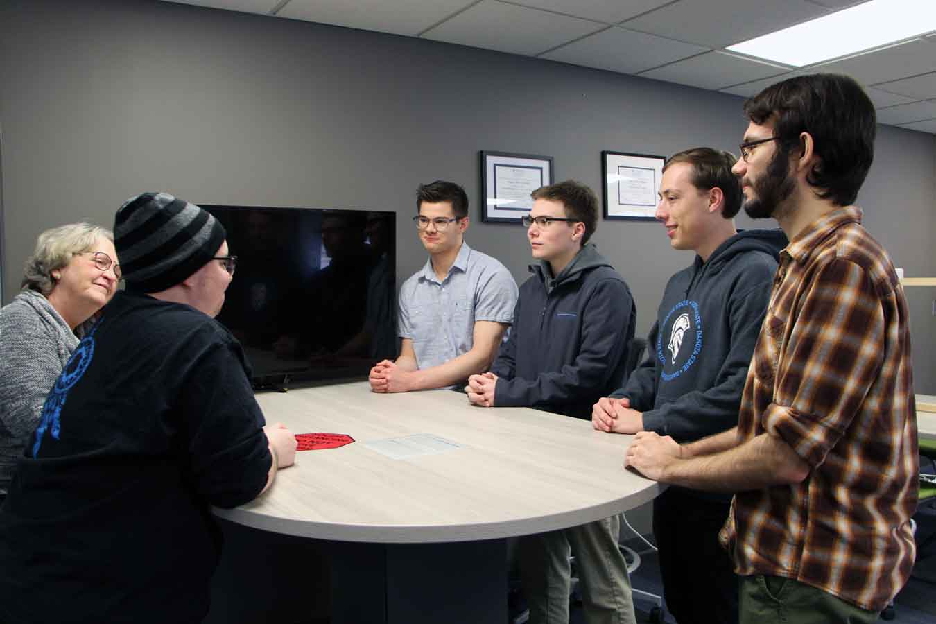 Patti Beck, Coordinator of Academic Support Services, talks with some of DSU’s tutoring team, including Vinny Campbell, Jonny Derenge, Tyler Thomas, Ryan Morganti, and José Magaña.