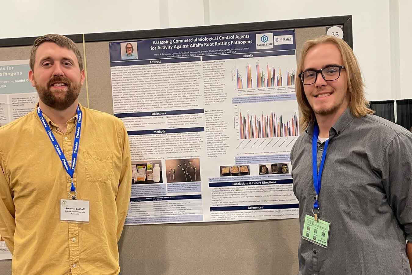 (l-to-r) Dr. Andrew Sathoff and Biology student Travis Rebstock pose for a photo at the World Alfalfa Congress