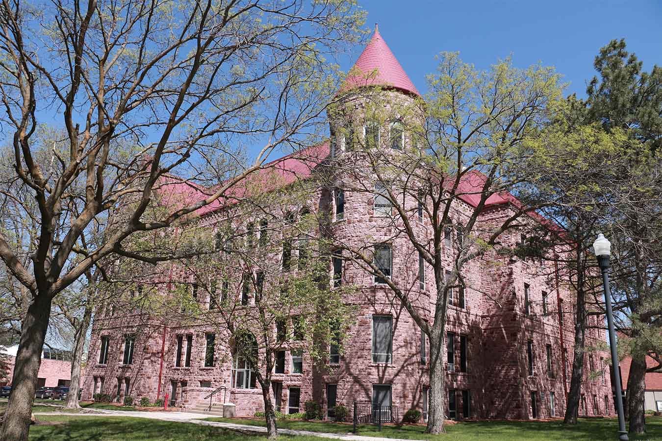 Image of East Hall on DSU's campus in spring