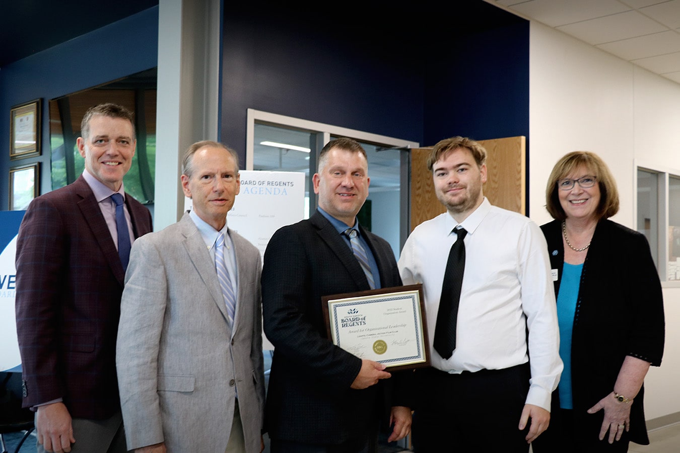 DSU’s Lights, Camera, Action Film Club received the Board of Regents’ Organizational Leadership award, accepted by Carson Knecht and advisor Joseph Staudenbaur. BOR Executive Director Nathan Lukkes, BOR President Tim Rave, and DSU President José-Marie Griffiths congratulated the group. 