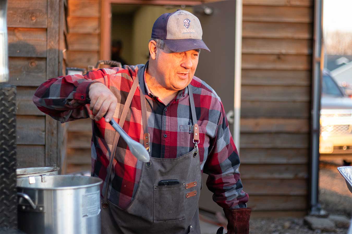 Athletic Director Jeff Dittman cooking at the Wild Game Feed. 