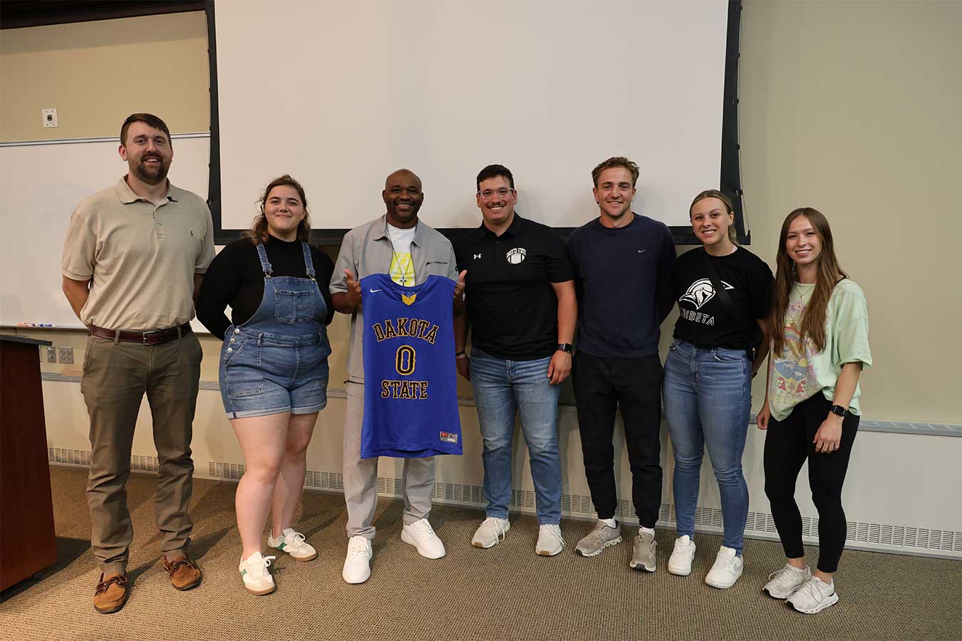 Tre Maddox (third from the left) poses for a photo with members of the TriBeta Club at DSU. 