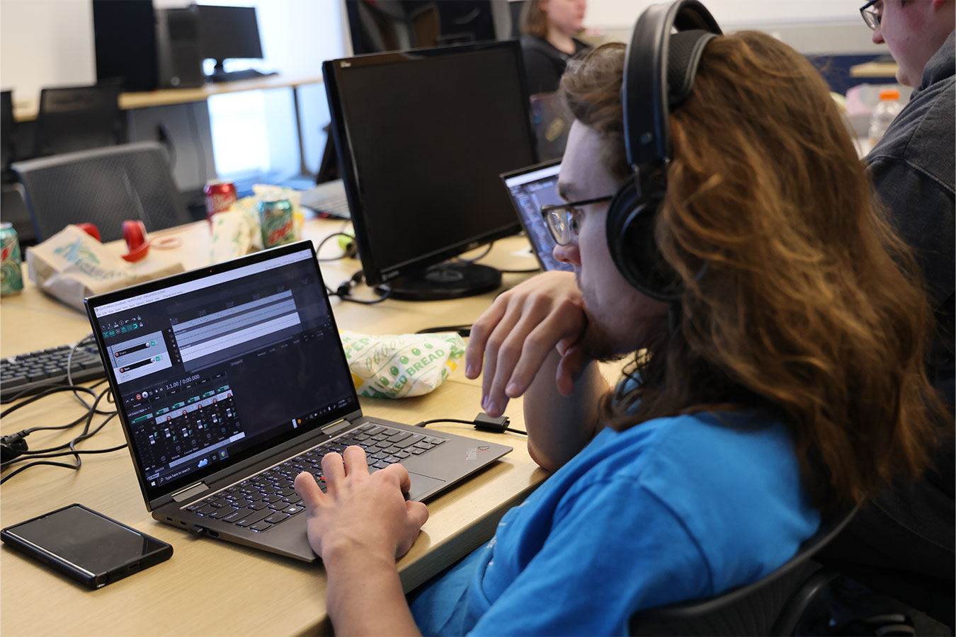 A student working on audio for a team game being created during the 2024 Global Game Jam session at DSU.