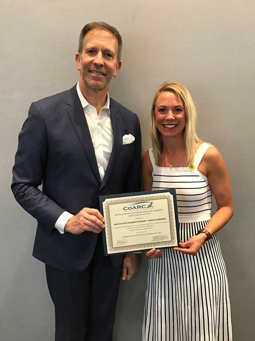 Lacy Patnoe, respiratory care program director, received the Distinguished RRT Credentialing Success Award from Dr. Allen Gustin, CoARC president. 