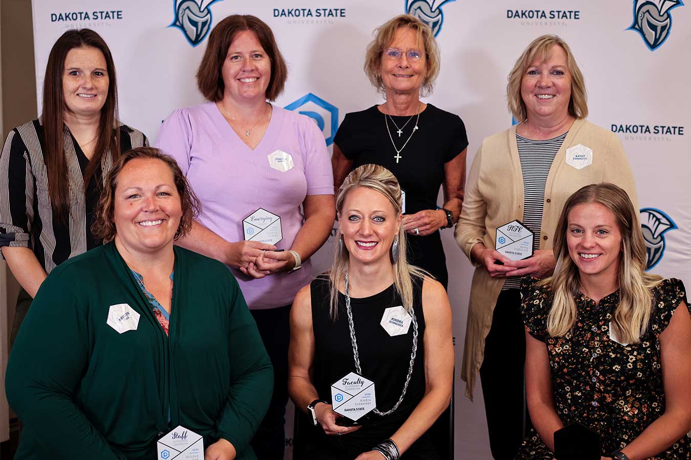 The 2024 True Trojan award winners include Sierra Heppler (back left), Fenecia Homan, Cherie Noteboom, Kathy Engbrecht; Kristen Uilk (front left), Kindra Schneider, Erin Kahler. Not pictured, Addie Borah.