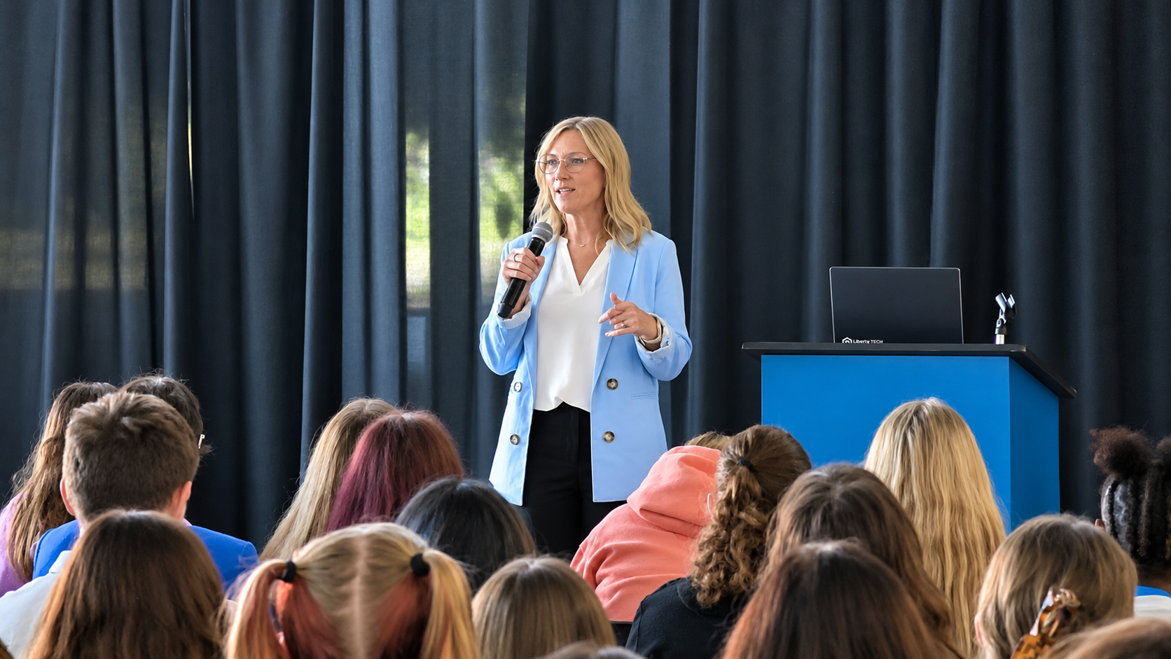 Becky Haenfler, the 2026 South Dakota Teacher of the Year, speaks at the Ed Rising event.