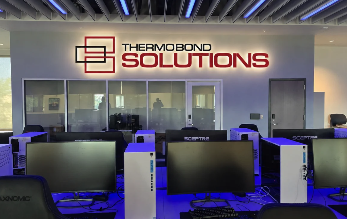 Mockup of Thermo Bond Solutions sign in DSU Esports Arena.
